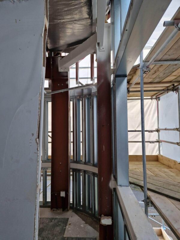 Steel columns and new facade framing during recladding