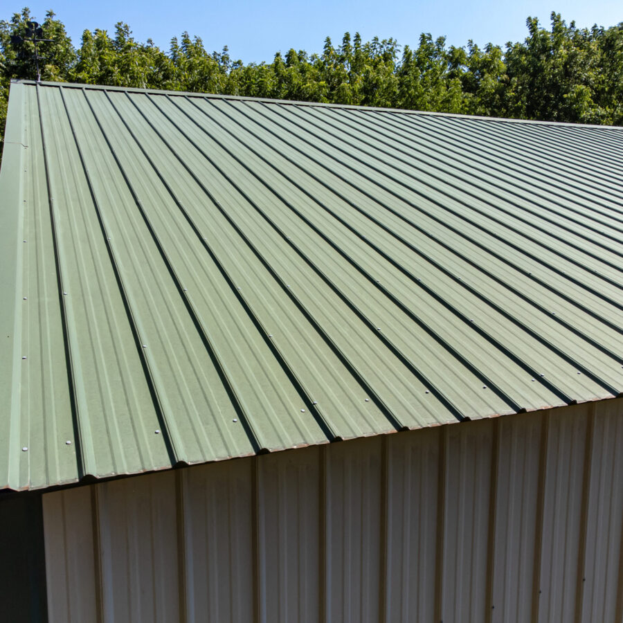 Green profiled metal roof on an outbuilding