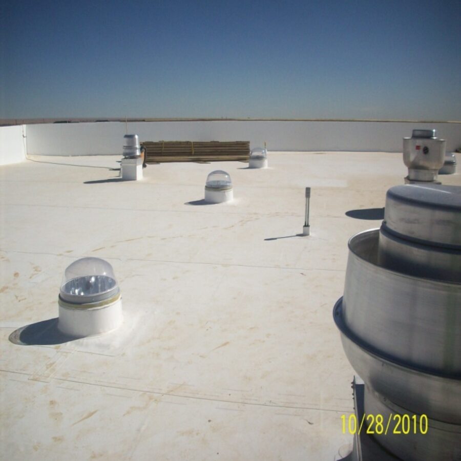 White TPO roof membrane around roof vents and skylights